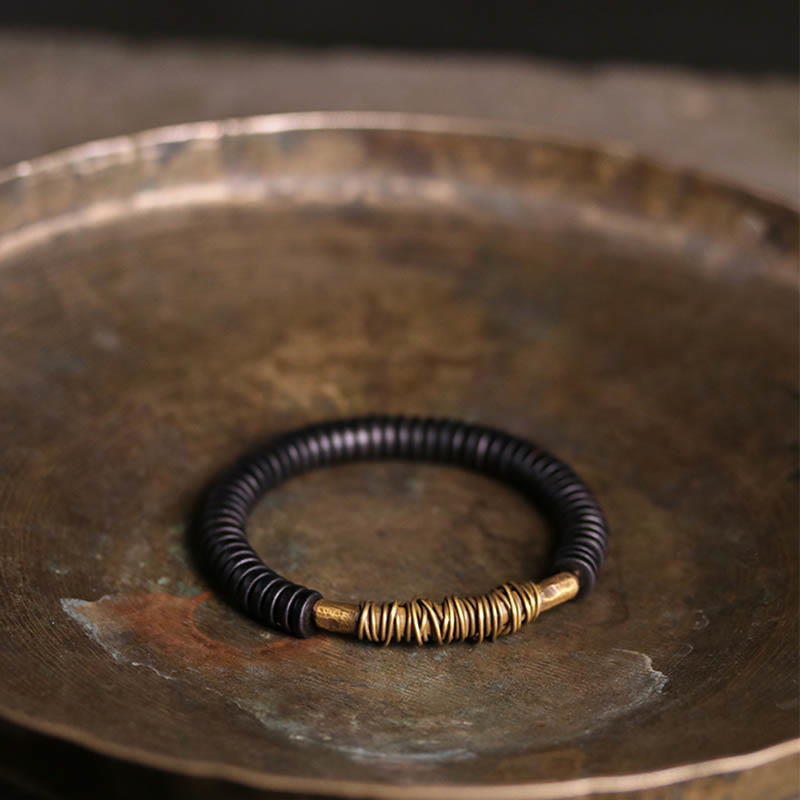 Pulsera de cobre y madera de ébano tibetano con Buddha Stones