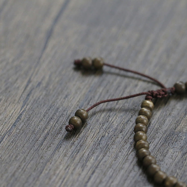 Pulsera sencilla de equilibrio de riqueza con cuentas de cobre y latón y Buddha Stones