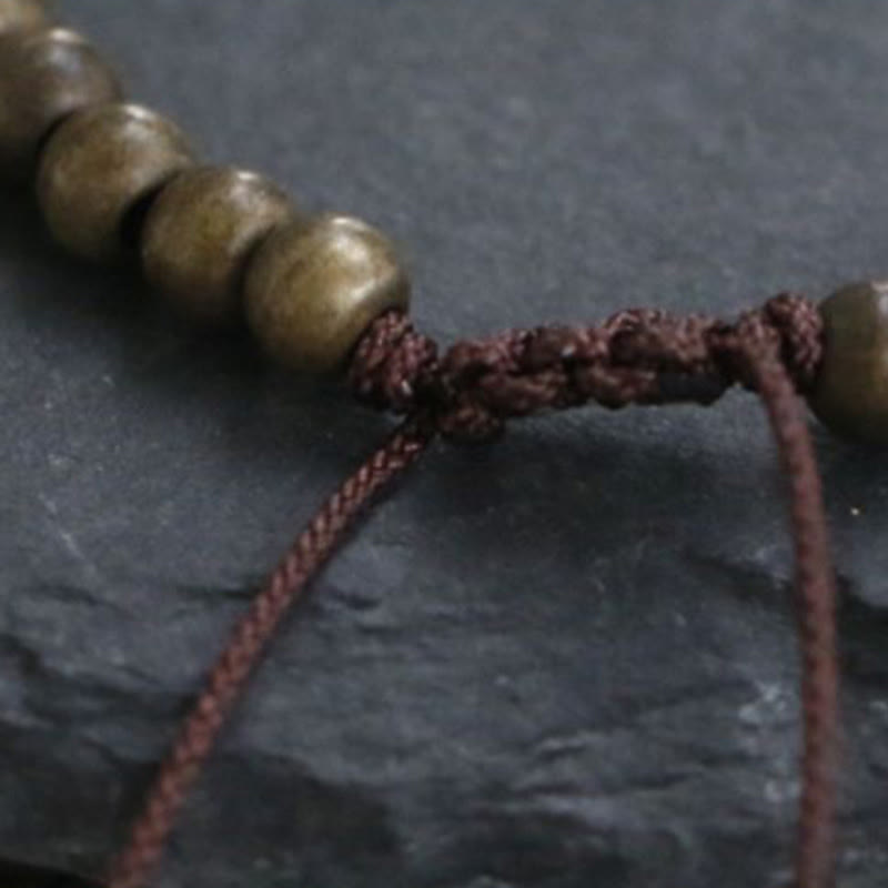 Pulsera sencilla de equilibrio de riqueza con cuentas de cobre y latón y Buddha Stones
