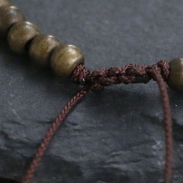 Pulsera sencilla de equilibrio de riqueza con cuentas de cobre y latón y Buddha Stones