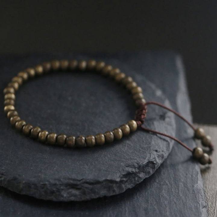 Pulsera sencilla de equilibrio de riqueza con cuentas de cobre y latón y Buddha Stones
