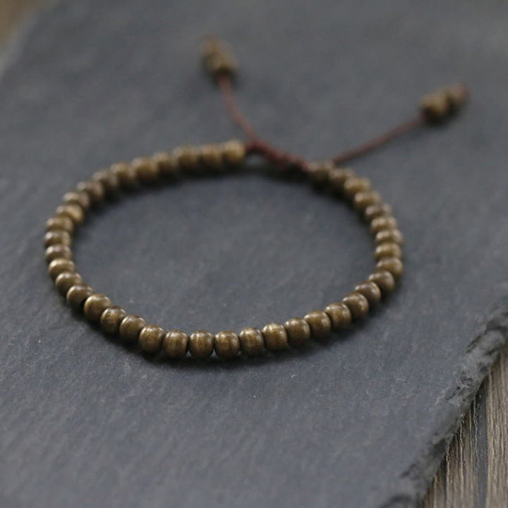 Pulsera sencilla de equilibrio de riqueza con cuentas de cobre y latón y Buddha Stones