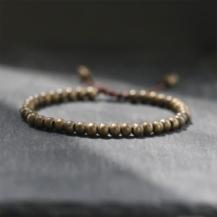 Pulsera sencilla de equilibrio de riqueza con cuentas de cobre y latón y Buddha Stones