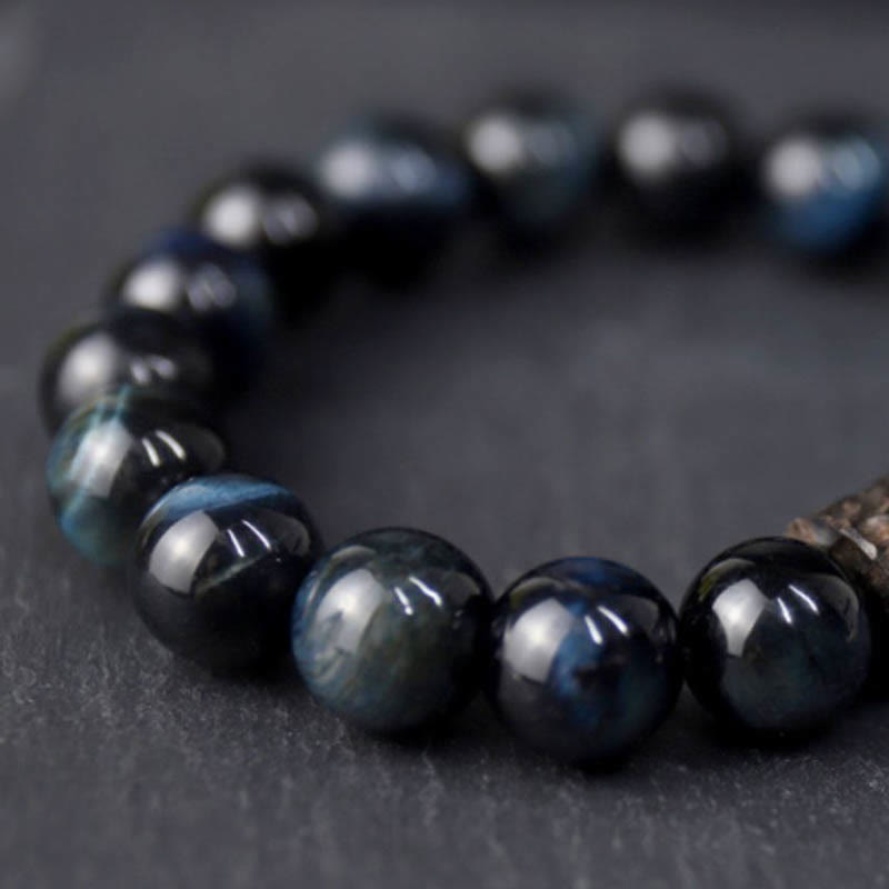 Pulsera de cuentas de madera de ébano y ojo de tigre con Buddha Stones