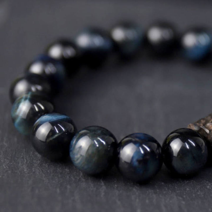 Pulsera de cuentas de madera de ébano y ojo de tigre con Buddha Stones