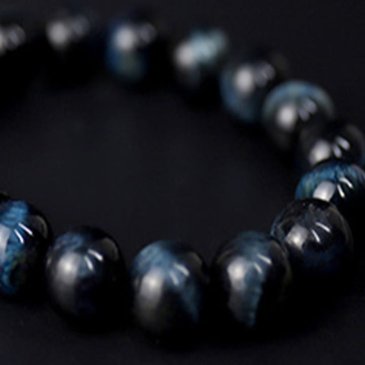Pulsera de cuentas de madera de ébano y ojo de tigre con Buddha Stones