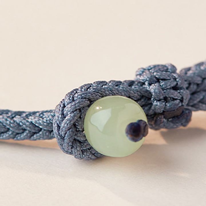 Pulsera de la fortuna con cuerda trenzada y hebilla de paz de loto de jade hetiano y Buddha Stones