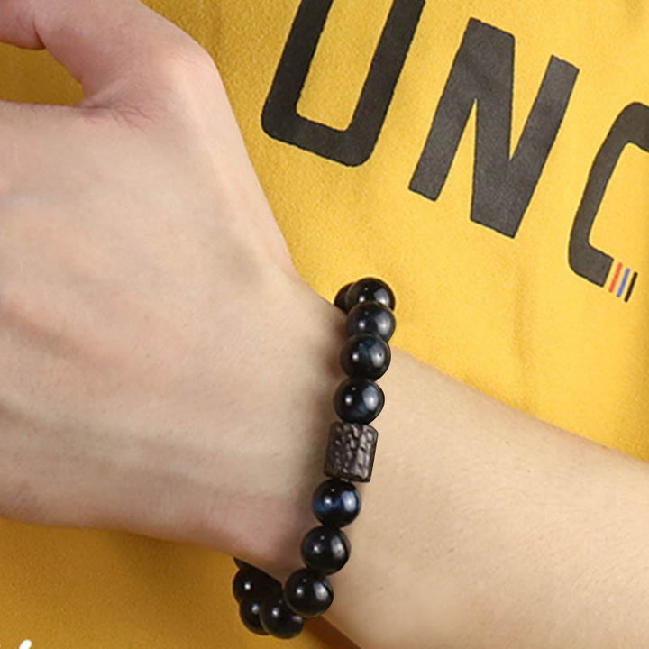 Pulsera de cuentas de madera de ébano y ojo de tigre con Buddha Stones