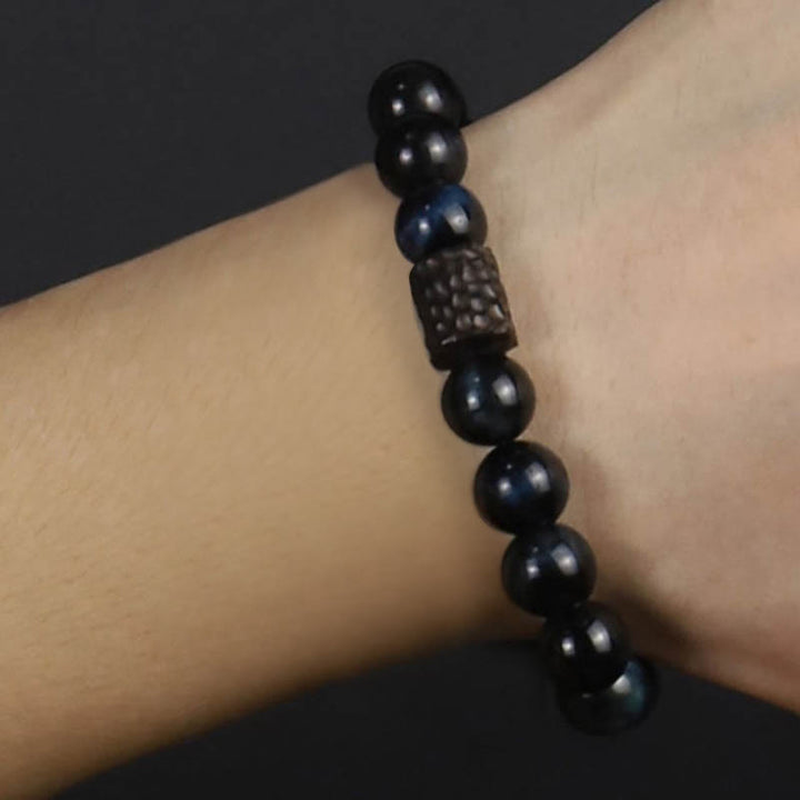 Pulsera de cuentas de madera de ébano y ojo de tigre con Buddha Stones