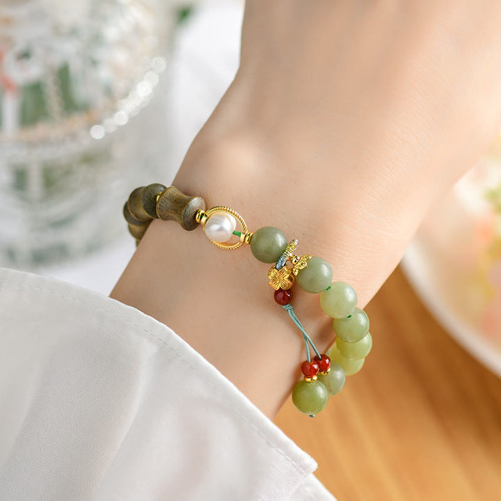 Pulsera de prosperidad con Buddha Stones, jade, sándalo, bambú y perla