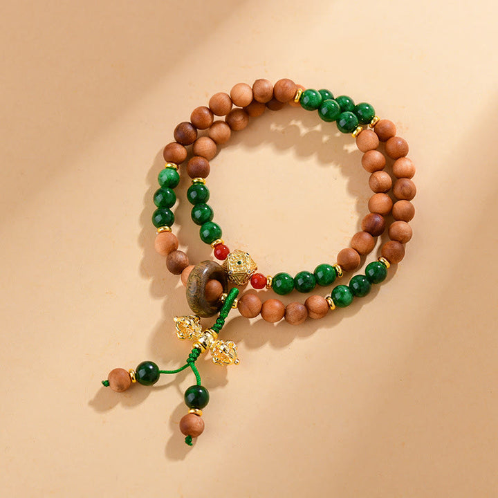Pulsera de protección y curación con diseño de doble torsión de Dorje Vajra del Tíbet con cuentas de madera de sándalo y Buddha Stones
