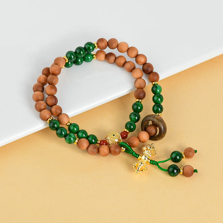 Pulsera de protección y curación con diseño de doble torsión de Dorje Vajra del Tíbet con cuentas de madera de sándalo y Buddha Stones