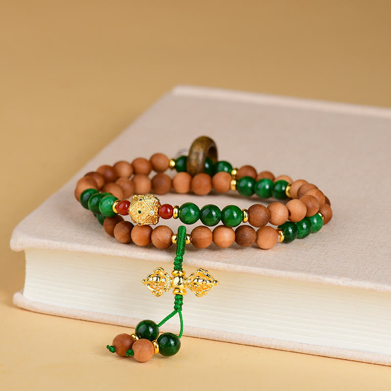 Pulsera de protección y curación con diseño de doble torsión de Dorje Vajra del Tíbet con cuentas de madera de sándalo y Buddha Stones