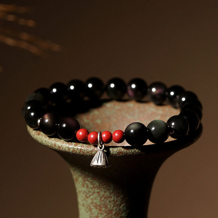 Pulsera de poder con dije de loto de cinabrio y obsidiana negra natural de Buddha Stones