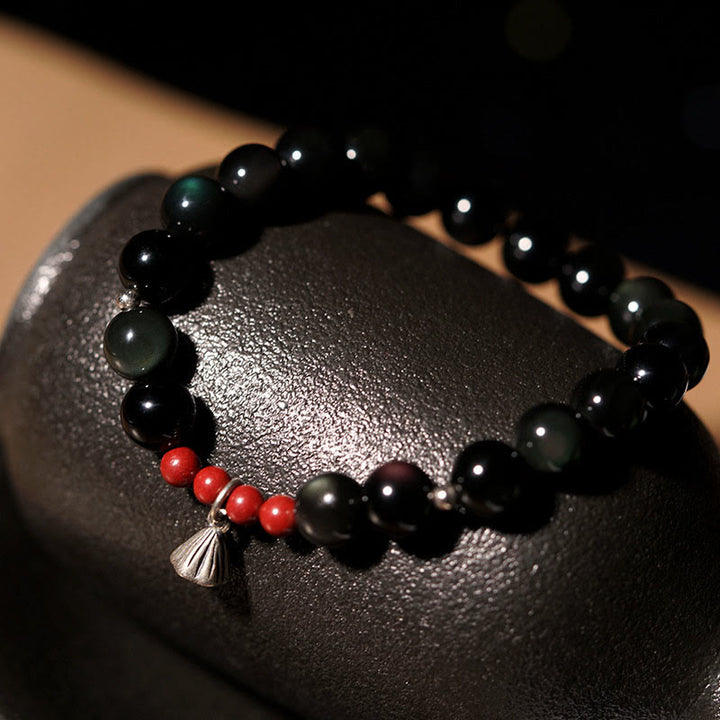 Pulsera de poder con dije de loto de cinabrio y obsidiana negra natural de Buddha Stones