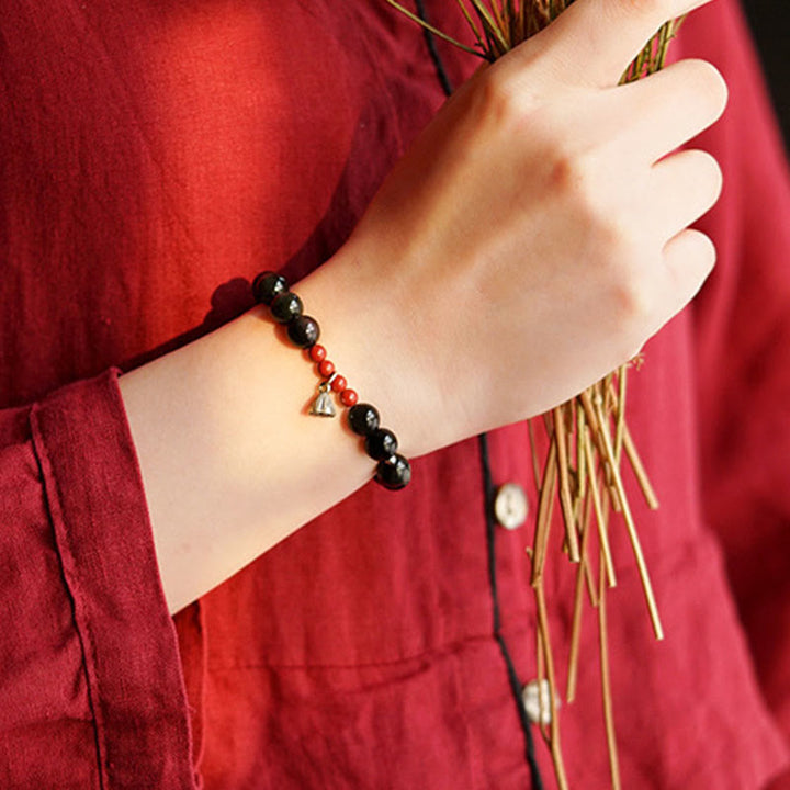 Pulsera de poder con dije de loto de cinabrio y obsidiana negra natural de Buddha Stones