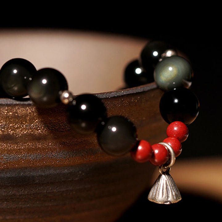 Pulsera de poder con dije de loto de cinabrio y obsidiana negra natural de Buddha Stones