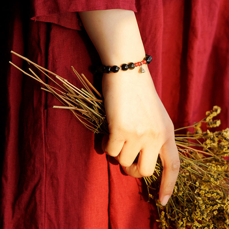 Pulsera de poder con dije de loto de cinabrio y obsidiana negra natural de Buddha Stones