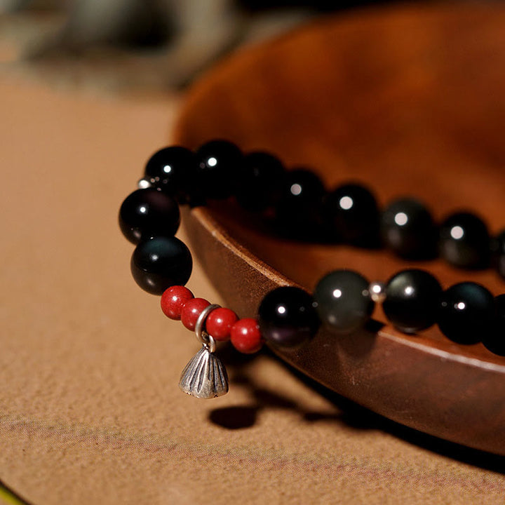 Pulsera de poder con dije de loto de cinabrio y obsidiana negra natural de Buddha Stones
