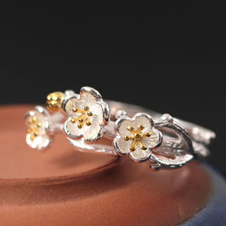 Anillo de plata de ley 925 con Buddha Stones y calma en el seno del ciruelo