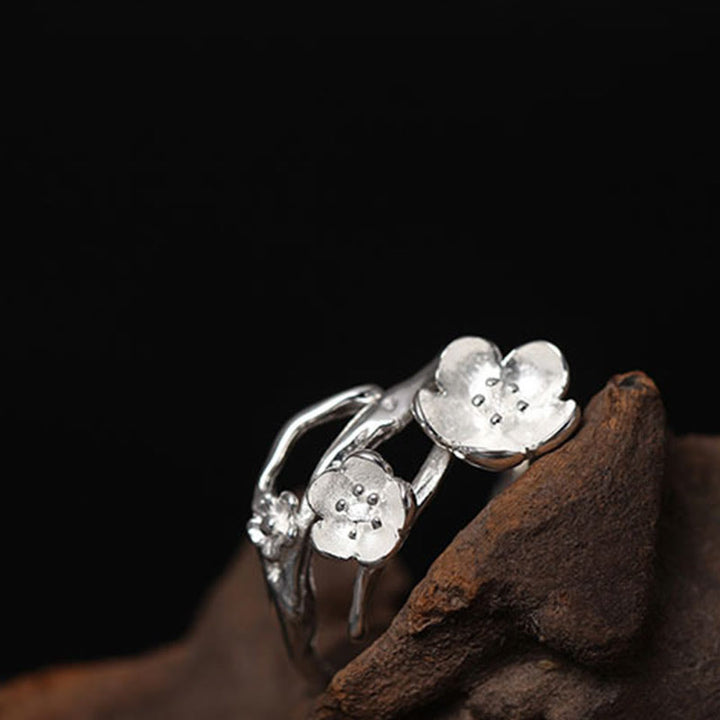 Anillo de equilibrio con seno ciruela y Buddha Stones en plata de ley 925