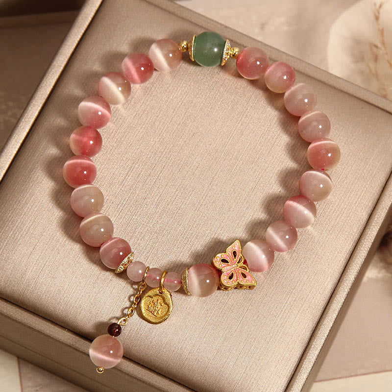 Pulsera de la paz con mariposa y ojo de gato en color rosa degradado con Buddha Stones