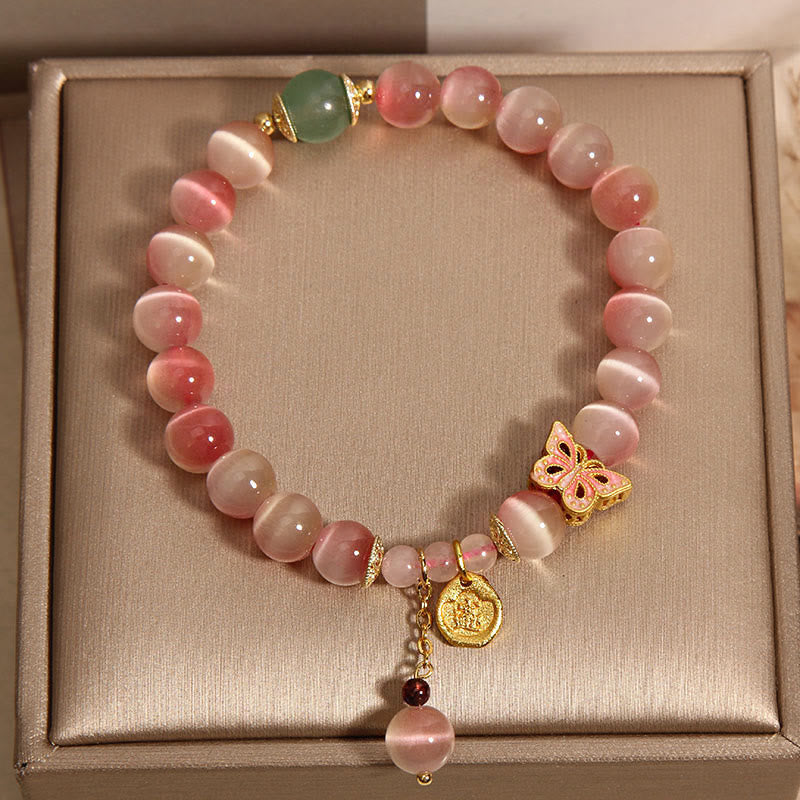Pulsera de la paz con mariposa y ojo de gato en color rosa degradado con Buddha Stones