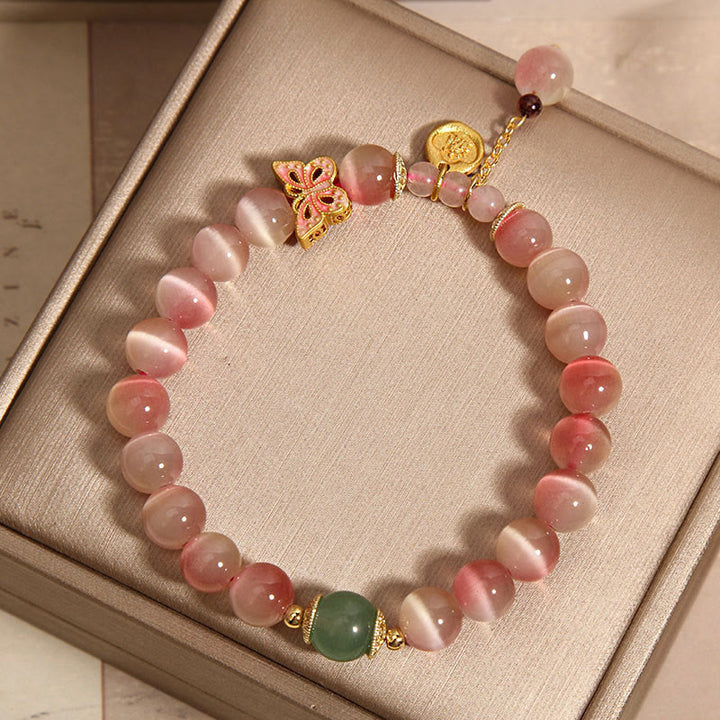 Pulsera de la paz con mariposa y ojo de gato en color rosa degradado con Buddha Stones