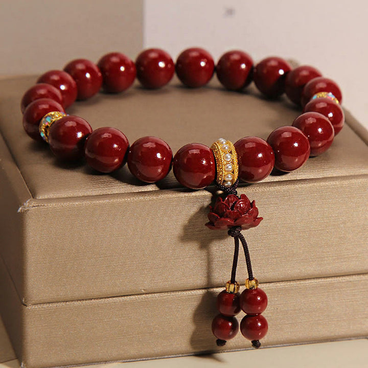 Pulsera con dijes de bendición de loto y cinabrio con Buddha Stones