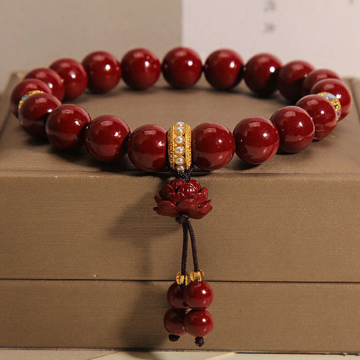 Pulsera con dijes de bendición de loto y cinabrio con Buddha Stones