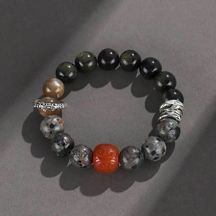 Pulsera protectora de ágata roja, obsidiana y roca de lava con brillo dorado de Buddha Stones