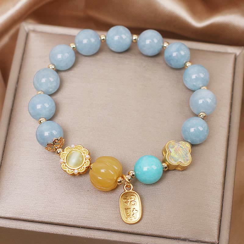 Pulsera de protección de la riqueza con aguamarina, calabaza y Buddha Stones