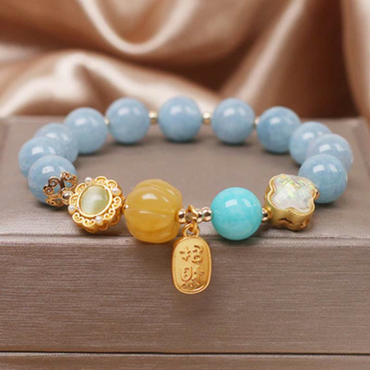 Pulsera de protección de la riqueza con aguamarina, calabaza y Buddha Stones