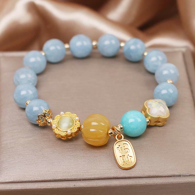 Pulsera de protección de la riqueza con aguamarina, calabaza y Buddha Stones