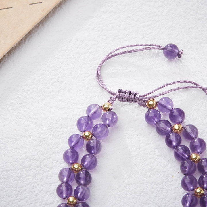 Pulsera de hilo trenzado que alivia el estrés con Buddha Stones, amatista, mariposa y bambú