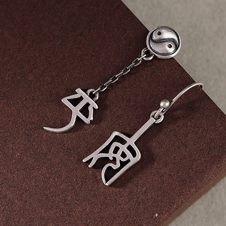 Pendientes de protección con caracteres chinos "Ping An" y "Xi Le" en plata de ley 925 con Buddha Stones