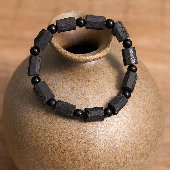 Pulsera de la sabiduría con turmalina negra y Buddha Stones