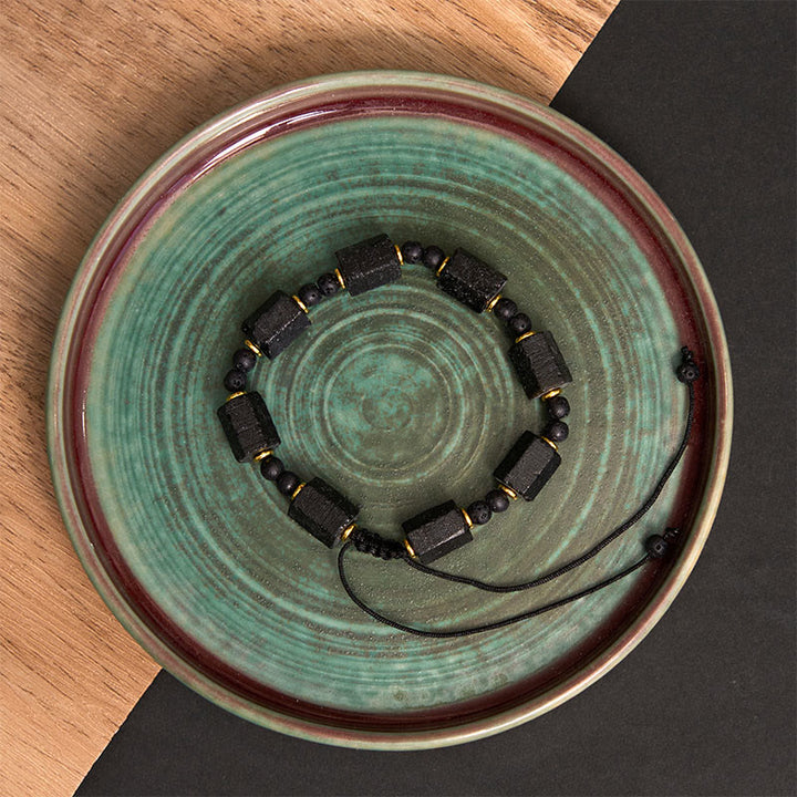 Pulsera de turmalina negra con Buddha Stones