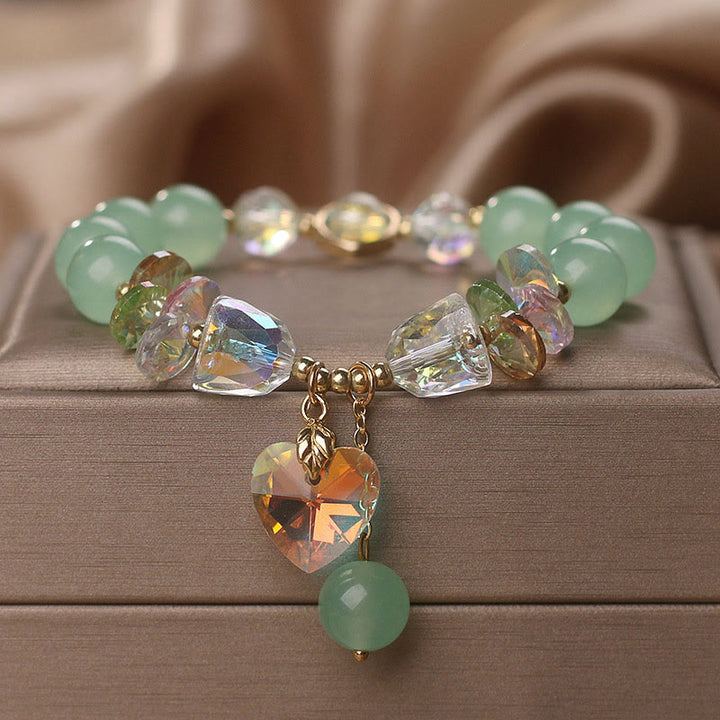 Pulsera curativa con dijes de corazón de amor y cristal verde aguamarina de Buddha Stones