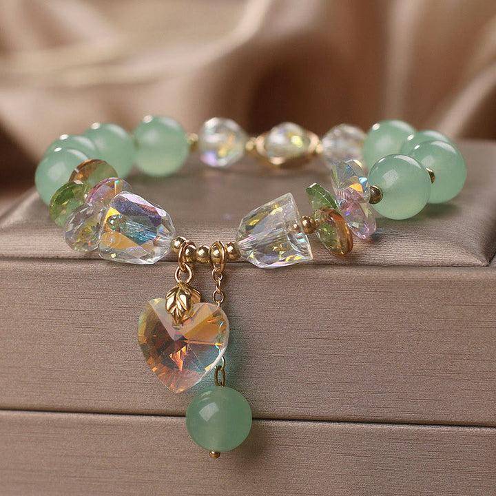 Pulsera curativa con dijes de corazón de amor y cristal verde aguamarina de Buddha Stones