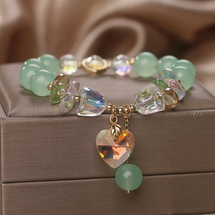 Pulsera curativa con dijes de corazón de amor y cristal verde aguamarina de Buddha Stones