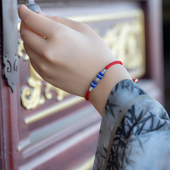 Pulsera protectora con caracteres chinos y hilo rojo de Buddha Stones