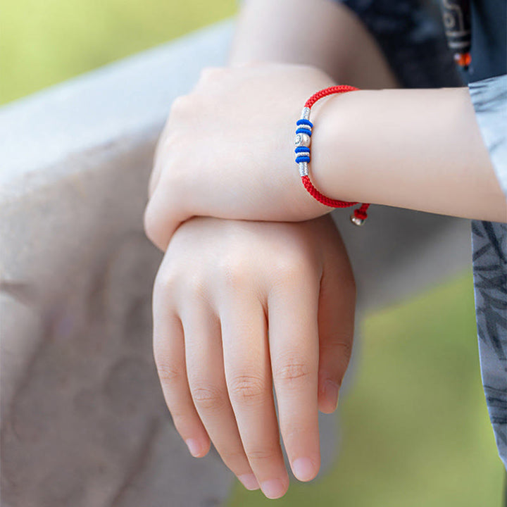 Pulsera protectora con caracteres chinos y hilo rojo de Buddha Stones