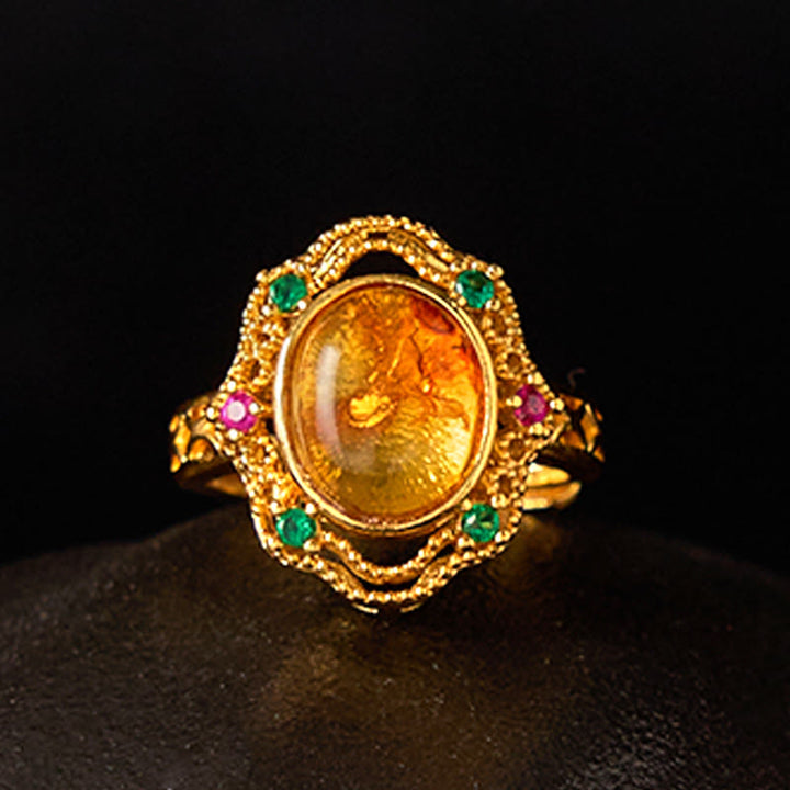 Anillo ajustable con encaje hueco de ámbar y flores de Buddha Stones
