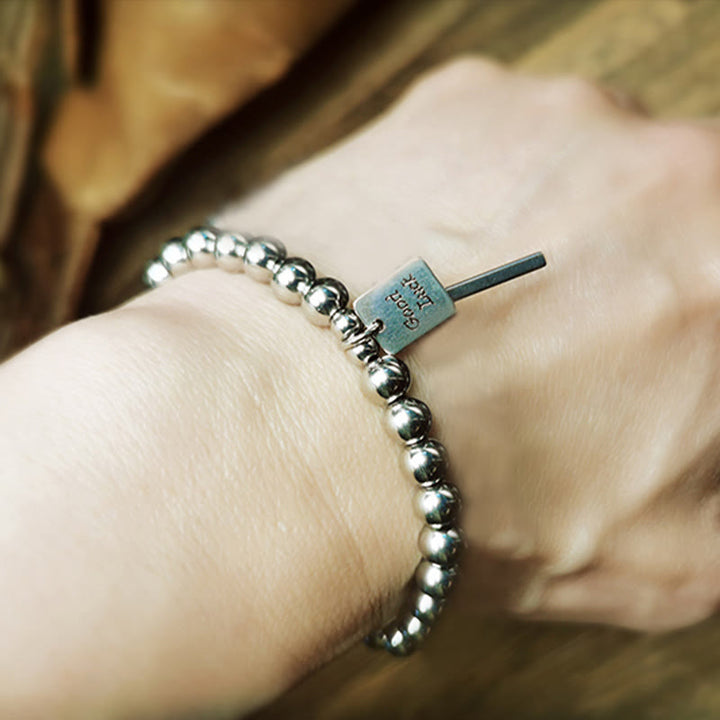 Pulsera de equilibrio de buena suerte de acero y titanio con Buddha Stones