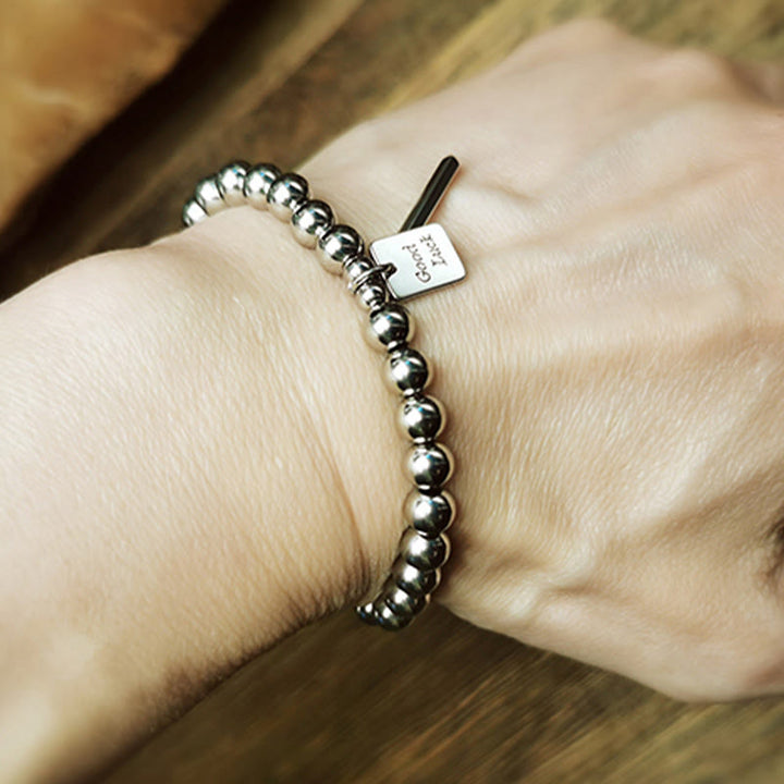 Pulsera de equilibrio de buena suerte de acero y titanio con Buddha Stones