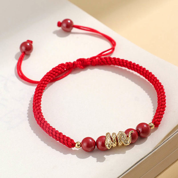 Pulsera trenzada de protección hecha a mano con Buddha Stones y cinabrio con hilo de serpiente