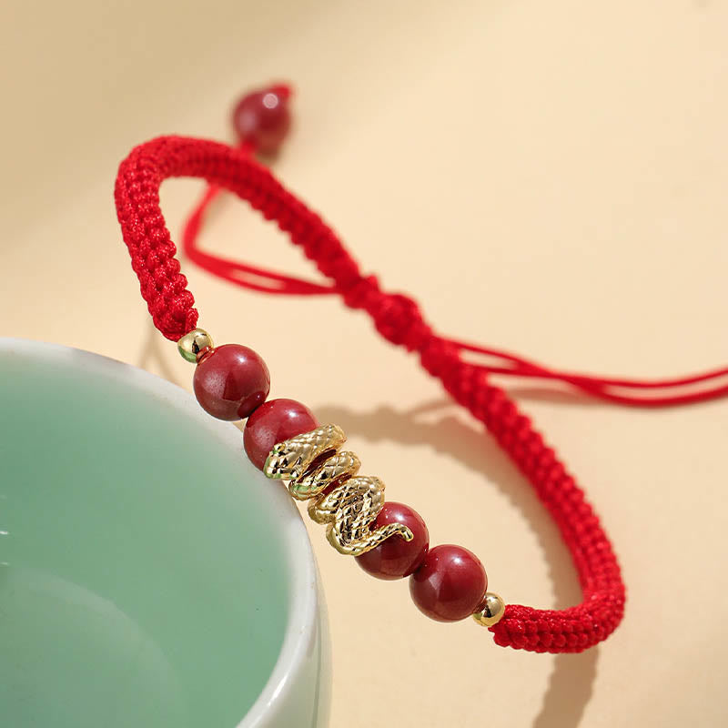 Pulsera trenzada de protección hecha a mano con Buddha Stones y cinabrio con hilo de serpiente