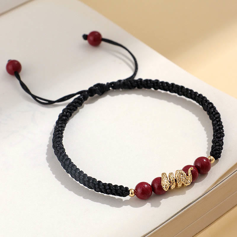Pulsera trenzada de protección hecha a mano con Buddha Stones y cinabrio con hilo de serpiente