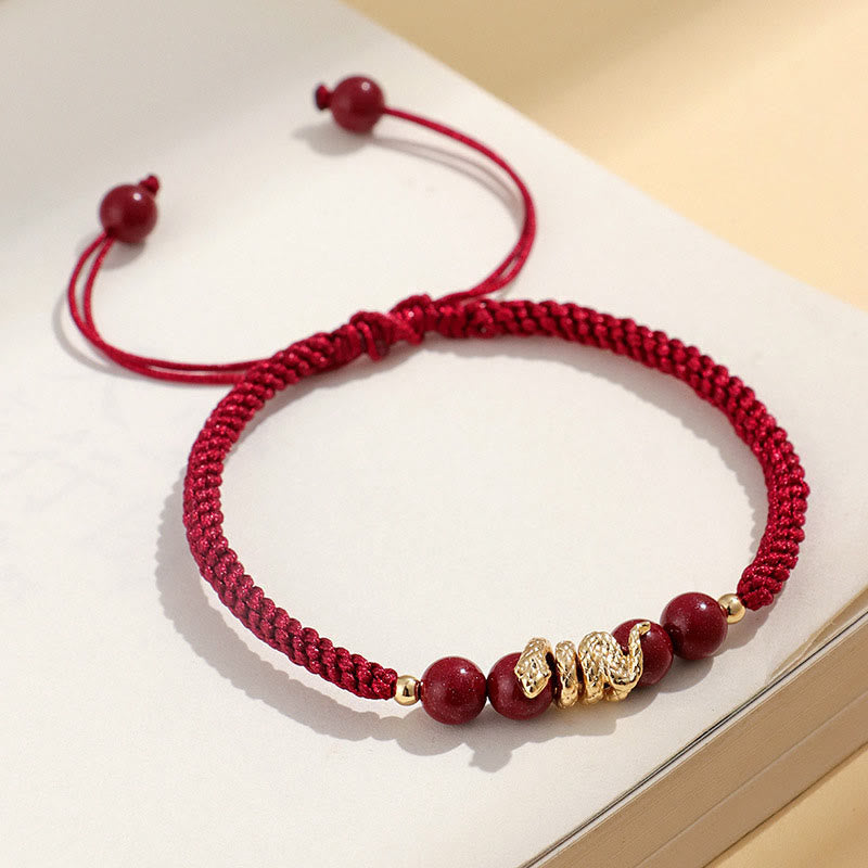 Pulsera trenzada de protección hecha a mano con Buddha Stones y cinabrio con hilo de serpiente